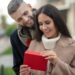 Happy young woman receiving a love letter
