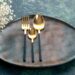 front view brown plate with golden cutlery on dark blue background cutlery glass silver food