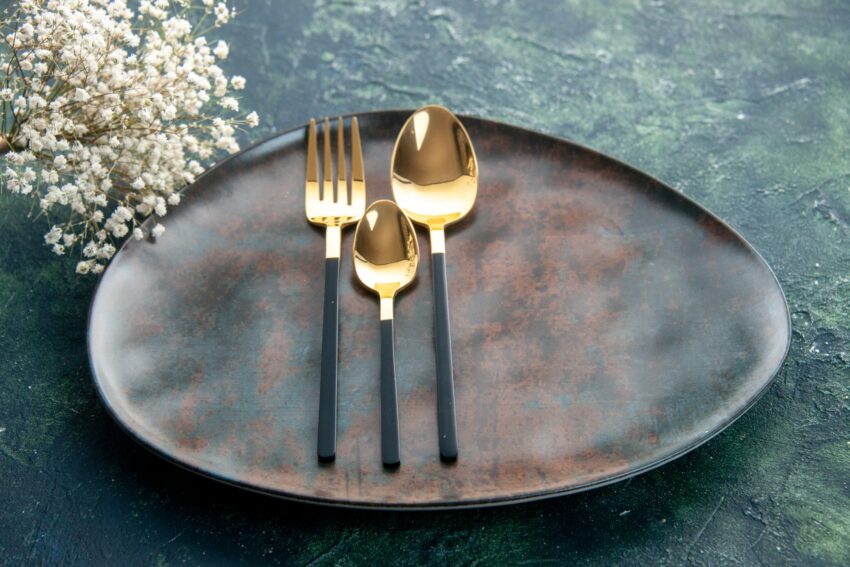 front view brown plate with golden cutlery on dark blue background cutlery glass silver food