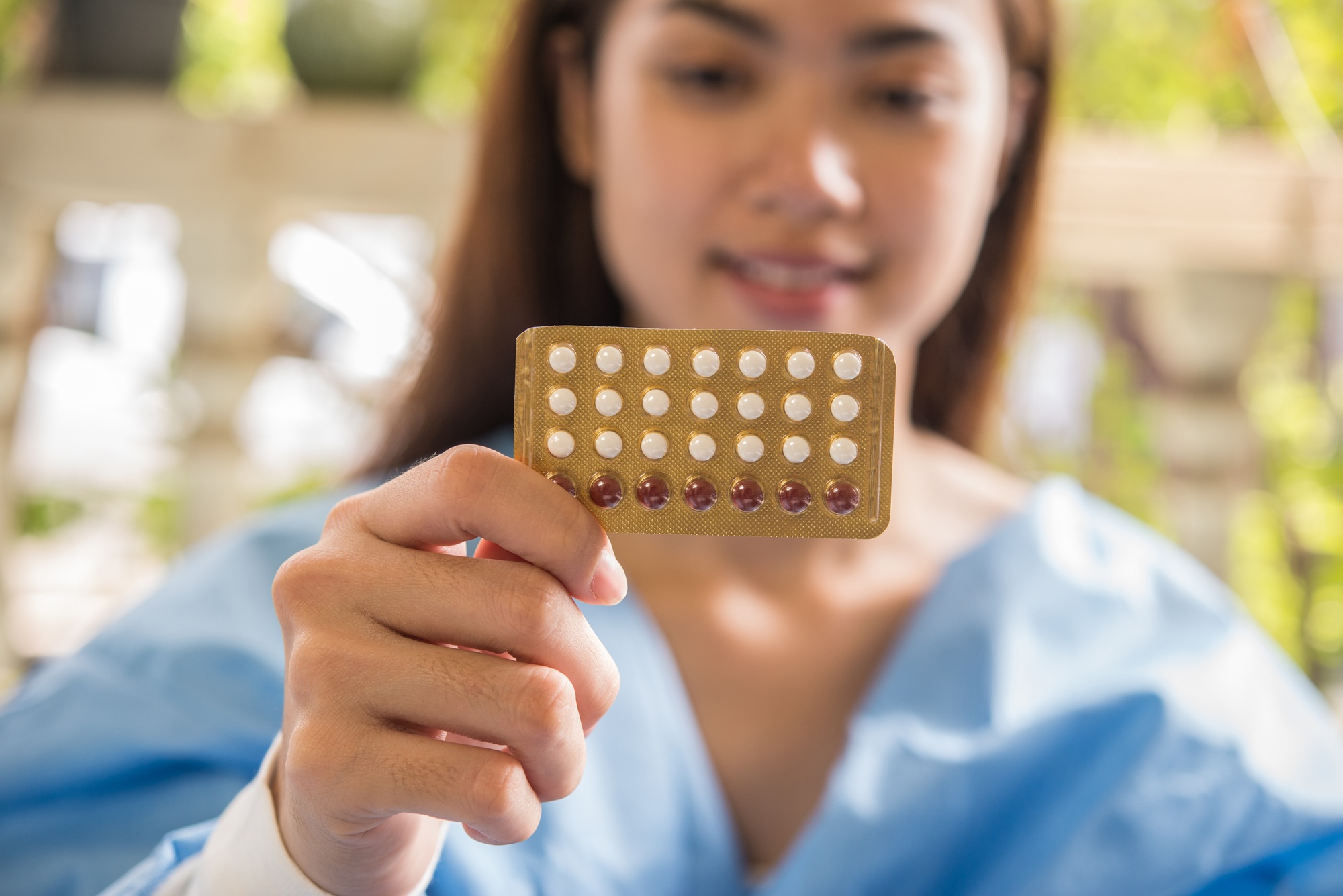Woman hand holding a contraceptive panel prevent pregnancy