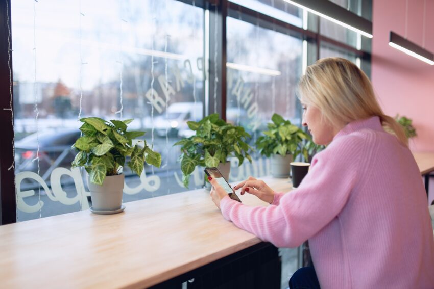 Woman on phone texting text message on smartphone