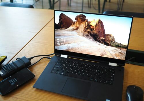 turned-on laptop computer beside mouse on desk